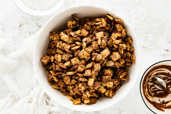 A large bowl with Chex cereal covered in melted chocolate.