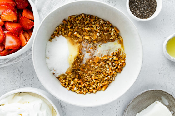 Crushed pretzels, melted butter, and sugar in a large mixing bowl.