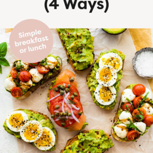 Four types of avocado toast on parchment paper.