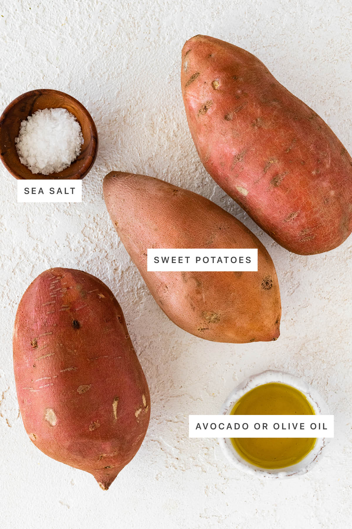 Ingredients measured out to make Perfect Baked Sweet Potato: sea salt, sweet potatoes and olive oil.