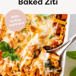 Easy Baked Ziti in a casserole dish with a serving spoon.