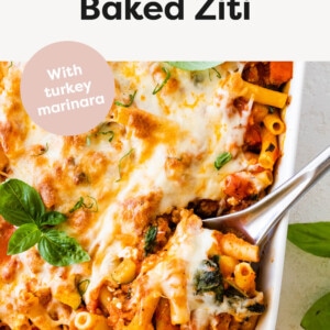 Easy Baked Ziti in a casserole dish with a serving spoon.