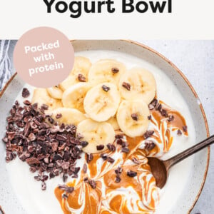 Chunky Monkey Yogurt Bowl topped with banana, peanut butter and cacao nibs.