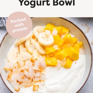 Tropical Yogurt Bowl topped with banana, coconut and mango.