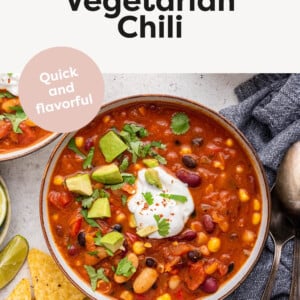 Bowl of Easy Vegetarian Chili topped with sour cream, avocado and cilantro.