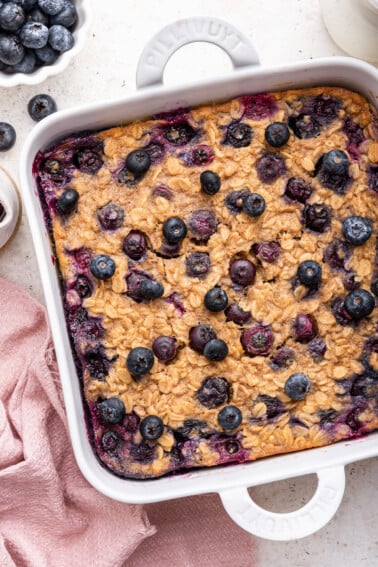 Blueberry baked oatmeal in a square baking dish.