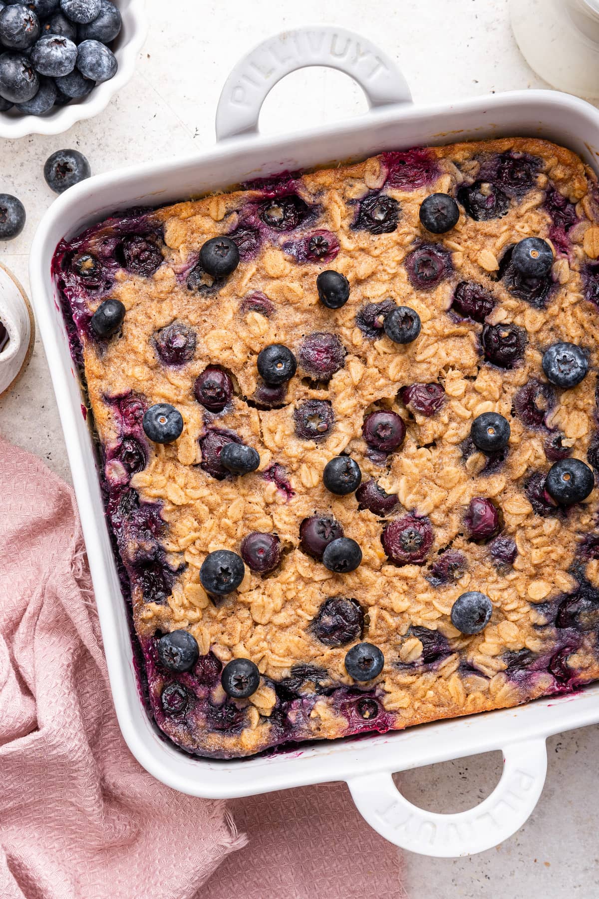 Blueberry baked oatmeal in a square baking dish.