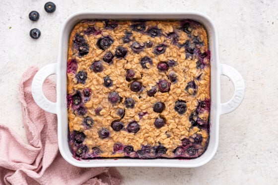 Blueberry baked oatmeal in a square baking dish.