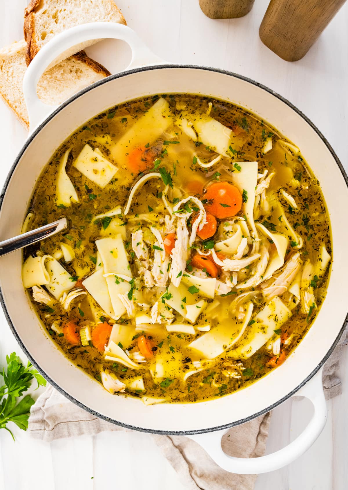 A large pot of chicken noodle soup.