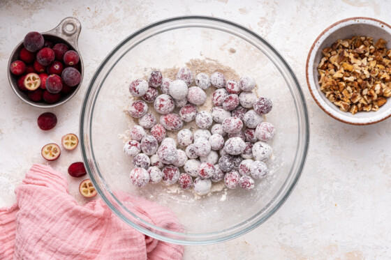 Fresh cranberries covered in oat flour.