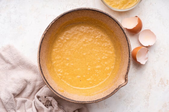 Beat eggs in a large mixing bowl.