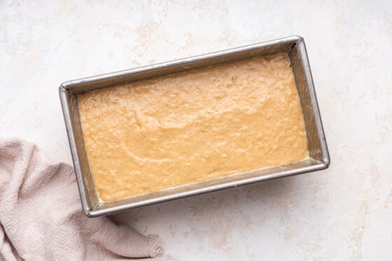 Dough for the banana bread in a loaf pan before being baked.