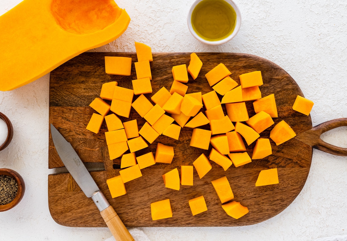 Cubed butternut squash on a cutting board.