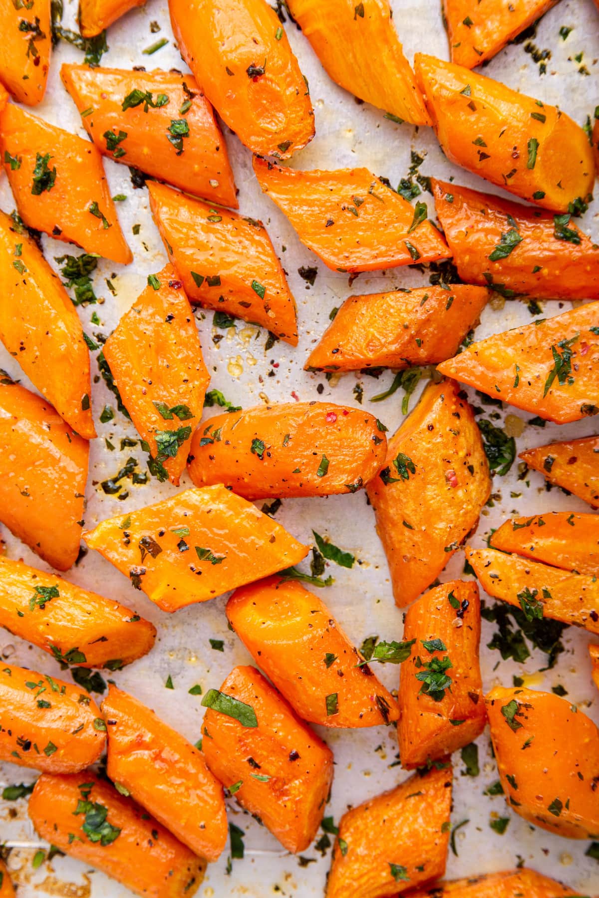 Roasted carrots on a sheet pan.