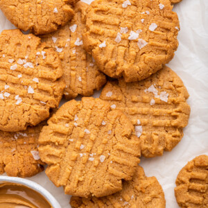 Peanut butter cookies on a piece of parchment paper.