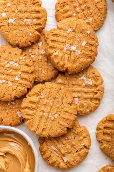 Peanut butter cookies on a piece of parchment paper.