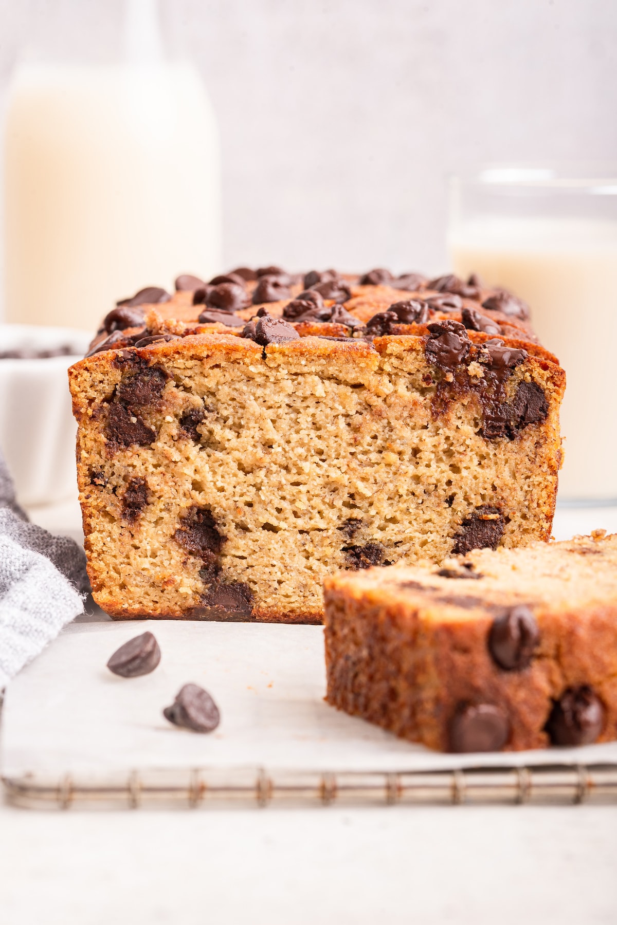 Almond flour banana bread with chocolate chips on a cooling rack.