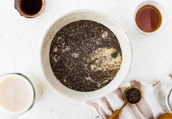 A large bowl with milk and chia seeds.