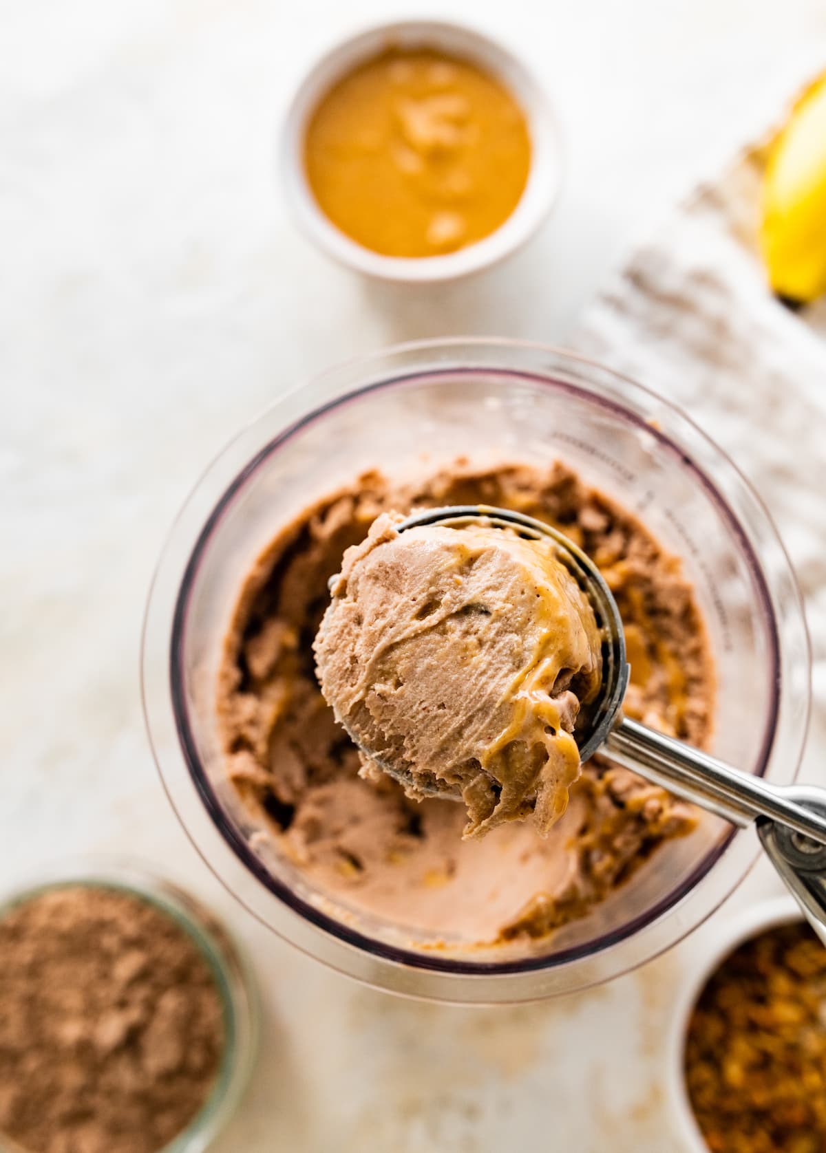 Ninja Creami ice cream being scooped with an ice cream scoop.