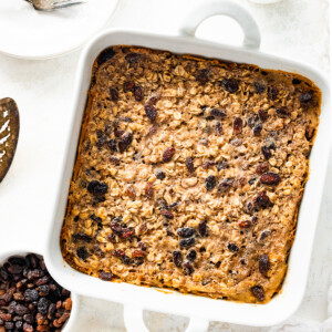 Cinnamon raisin baked oatmeal in a square baking dish.