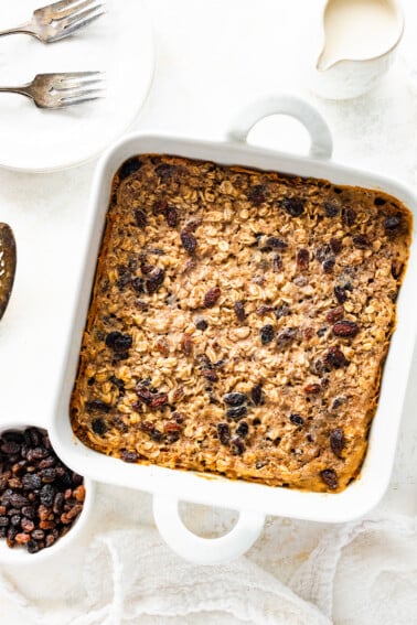 Cinnamon raisin baked oatmeal in a square baking dish.