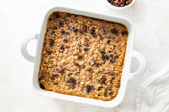 Cinnamon raisin baked oatmeal in a square baking dish after being baked in the oven.