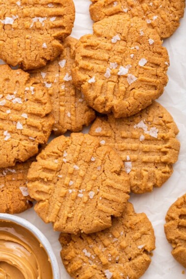 Peanut butter cookies on a piece of parchment paper.