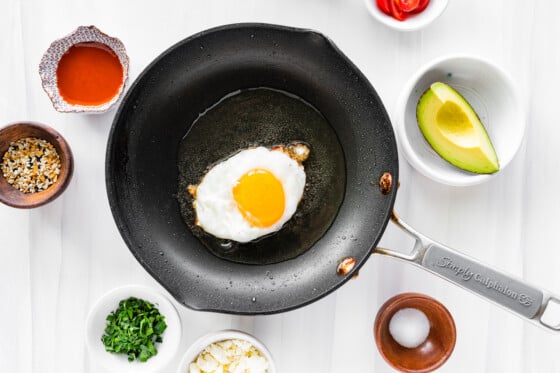 A sunny side up egg in a pan.