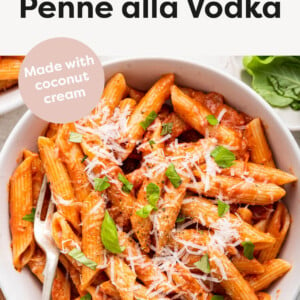 Bowl of Vegan Penne alla Vodka topped with parmesan and basil.