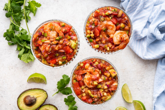 Three mexican shrimp cocktails in a glasses.