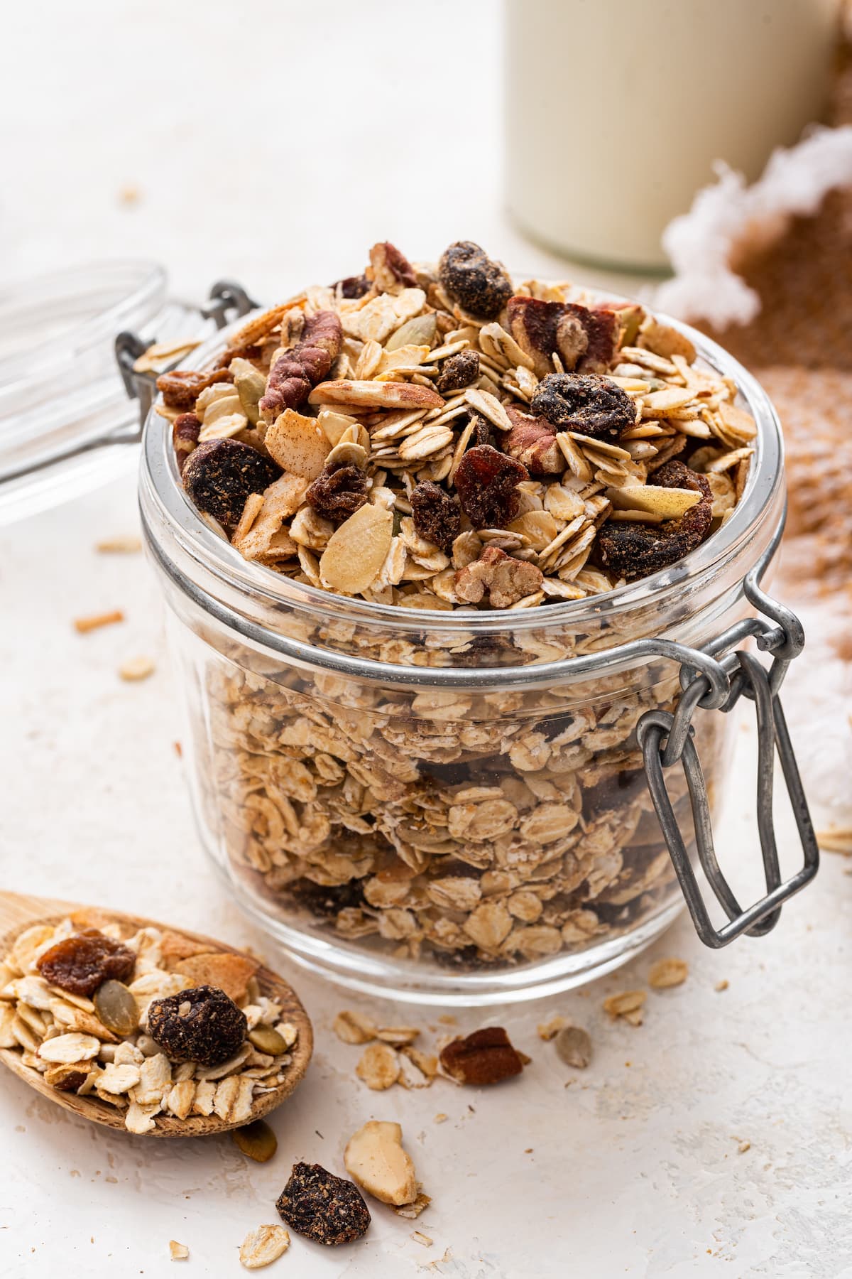 A glass jar filled with muesli.