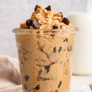 Protein cookie dough in a glass cup.