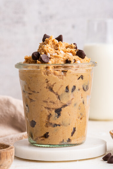 Protein cookie dough in a glass cup.