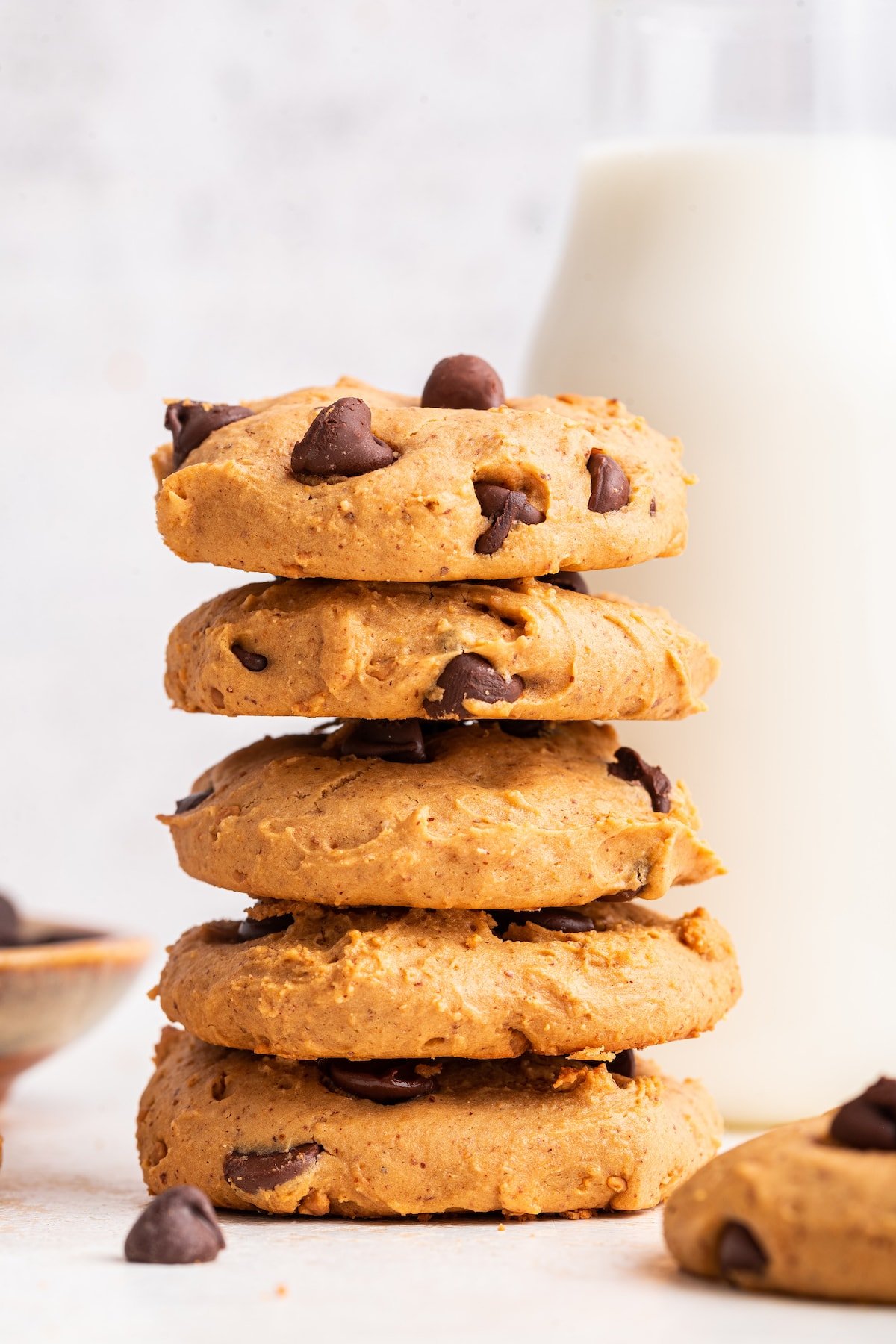 Multiple protein chocolate chip cookies stacked on one another.