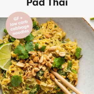 Healthy Pad Thai served on a plate with lime, cilantro, peanuts and chop sticks.