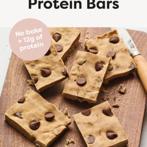 Peanut butter chocolate chip protein bars on a cutting board.