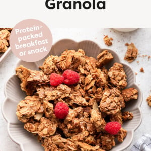 Protein Granola in a bowl with raspberries.