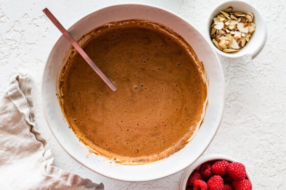 A chocolate chia seed pudding mixture in a large mixing bowl.