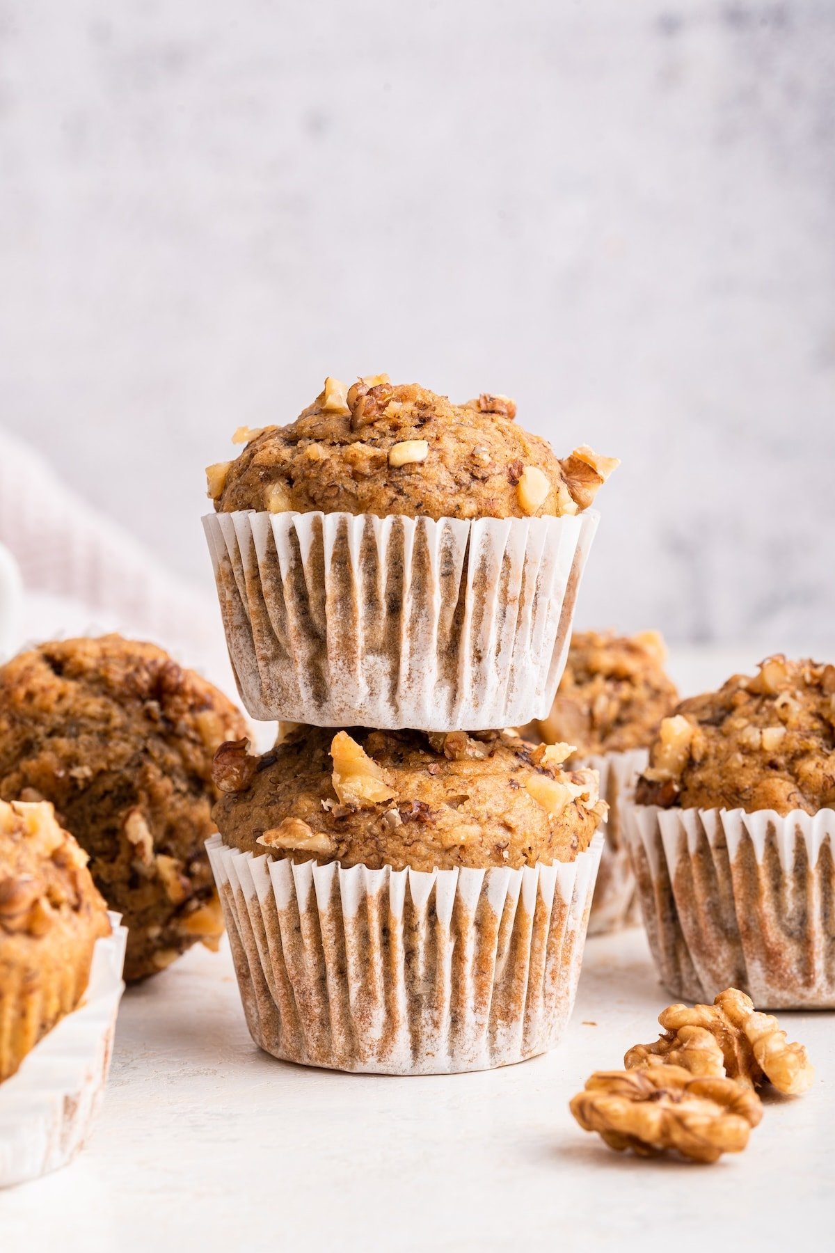 Two banana muffins stacked on one another.