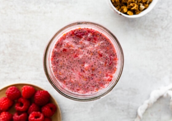 Raspberry chia pudding in a mason jar.