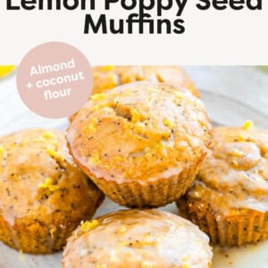 Five glazed lemon poppyseed muffins on a plate.