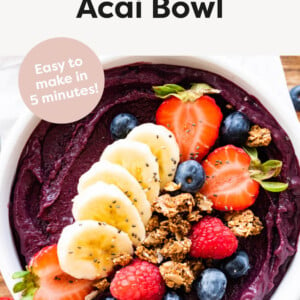 An acai bowl topped with berries, granola and chia seeds.