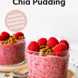 Two glass jars with Raspberry Chia Pudding topped with raspberries and granola.