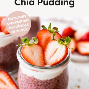 Strawberry Chia Pudding in a jar topped with yogurt and strawberries.