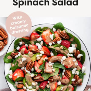 Strawberry Spinach Salad topped with goat cheese, pecans and creamy balsamic dressing.