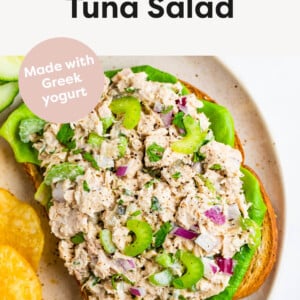 Tuna Salad on an open face sandwich served with chips.
