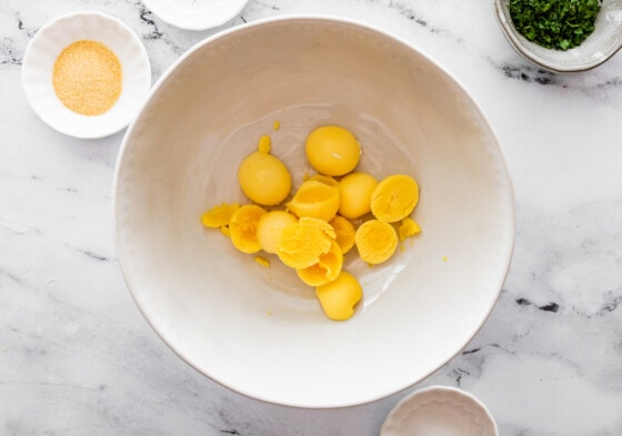 Hard boiled egg yolks in a large mixing bowl.