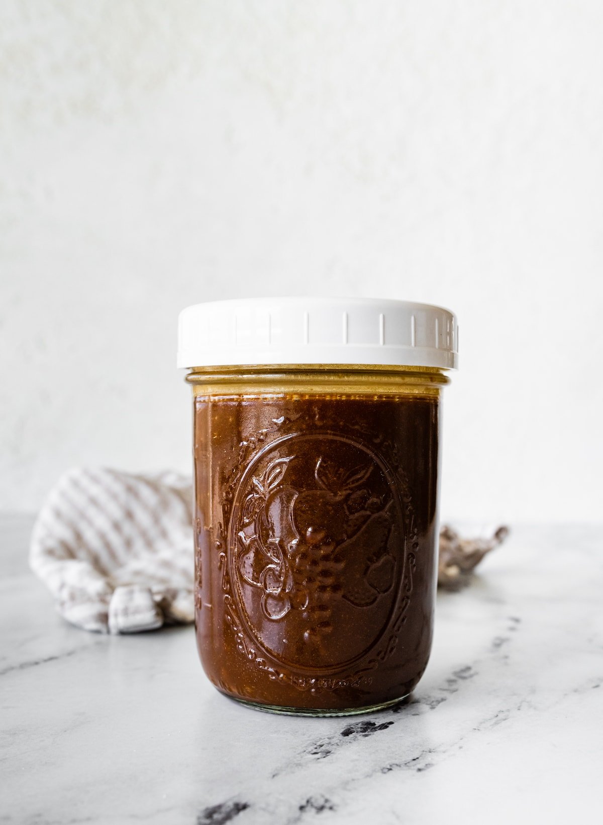 A balsamic vinaigrette in a glass jar.