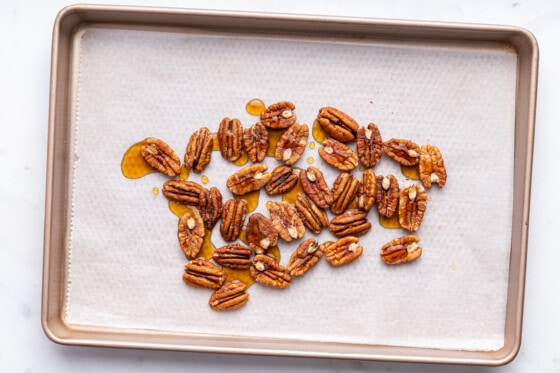Pecans on a baking sheet ready to be roasted for the blueberry corn chicken salad.