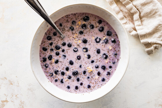 A bowl of overnight oats with blueberries.